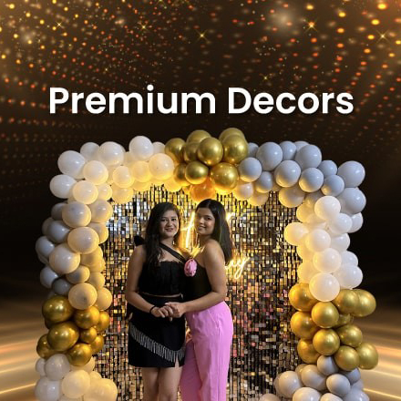 Glamorous party decoration featuring a silver sequin shimmer wall backdrop framed by an elegant balloon arch in white, silver, and gold, perfect for premium event decor in Gurgaon.