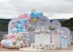 Baby shower decoration in Gurgaon with pink and blue balloons, teddy bears, and a 'Boy or Girl' backdrop by Adore Celebration.