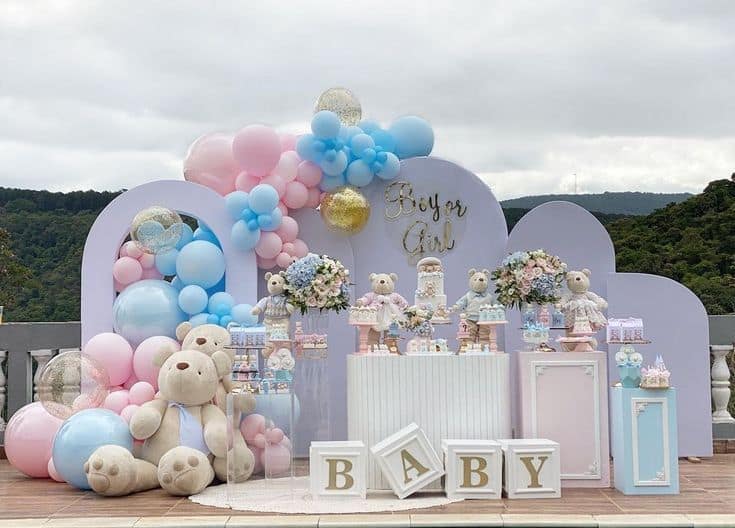 Baby shower decoration in Gurgaon with pink and blue balloons, teddy bears, and a 'Boy or Girl' backdrop by Adore Celebration.