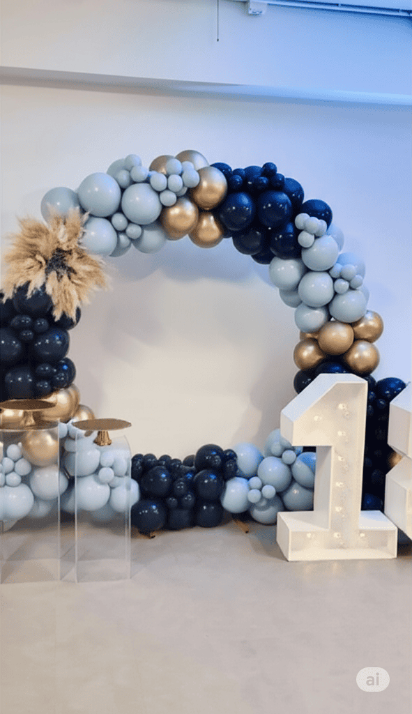 A festive party setup featuring a large, circular balloon arch with multi color balloon.